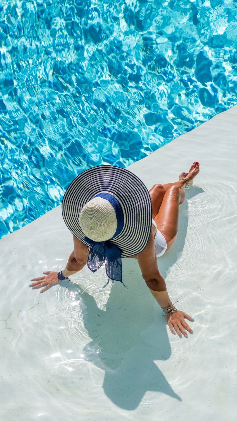 Technician performing a professional swimming pool inspection