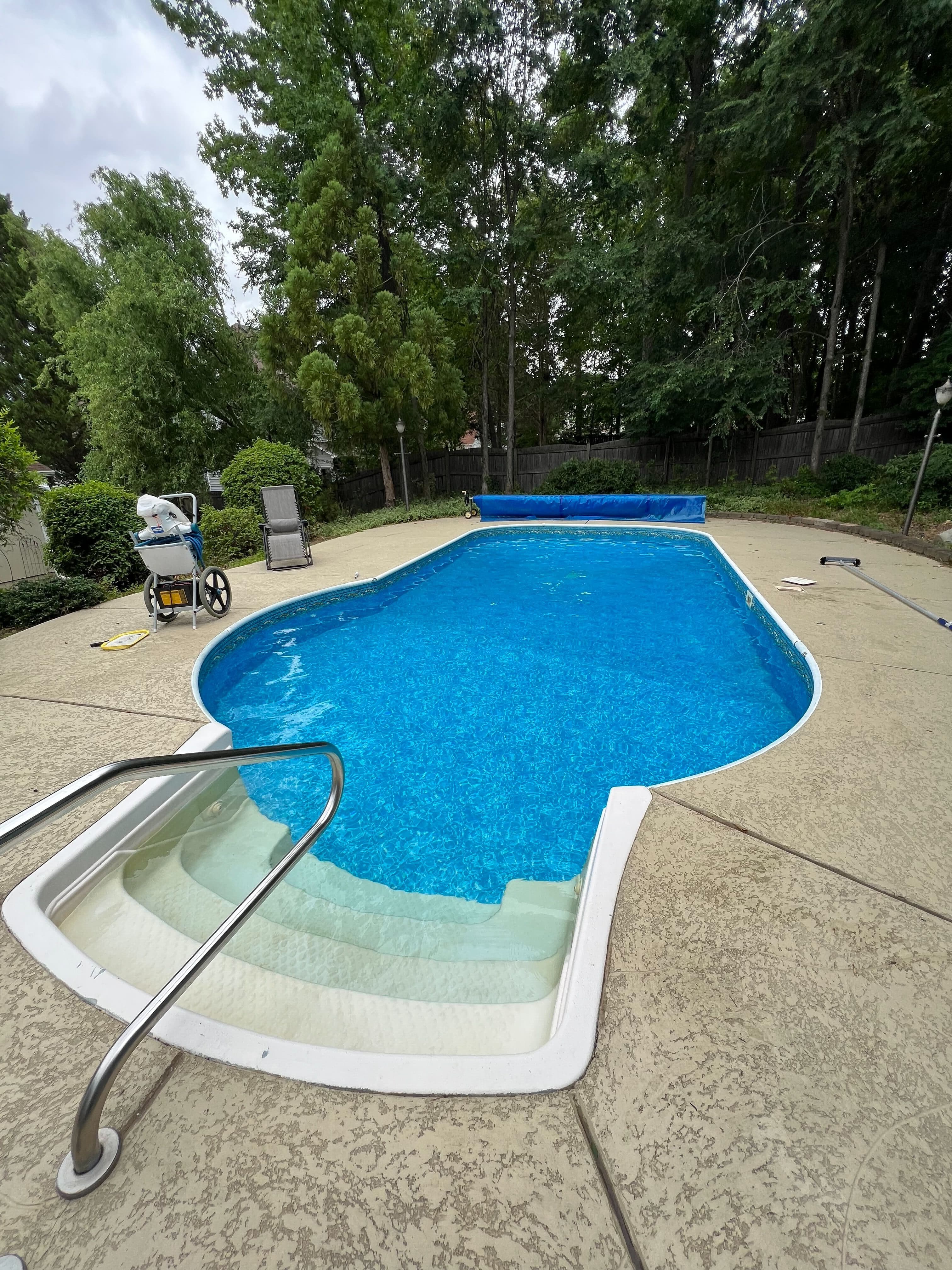 Residential in-ground pool during cleaning and water care