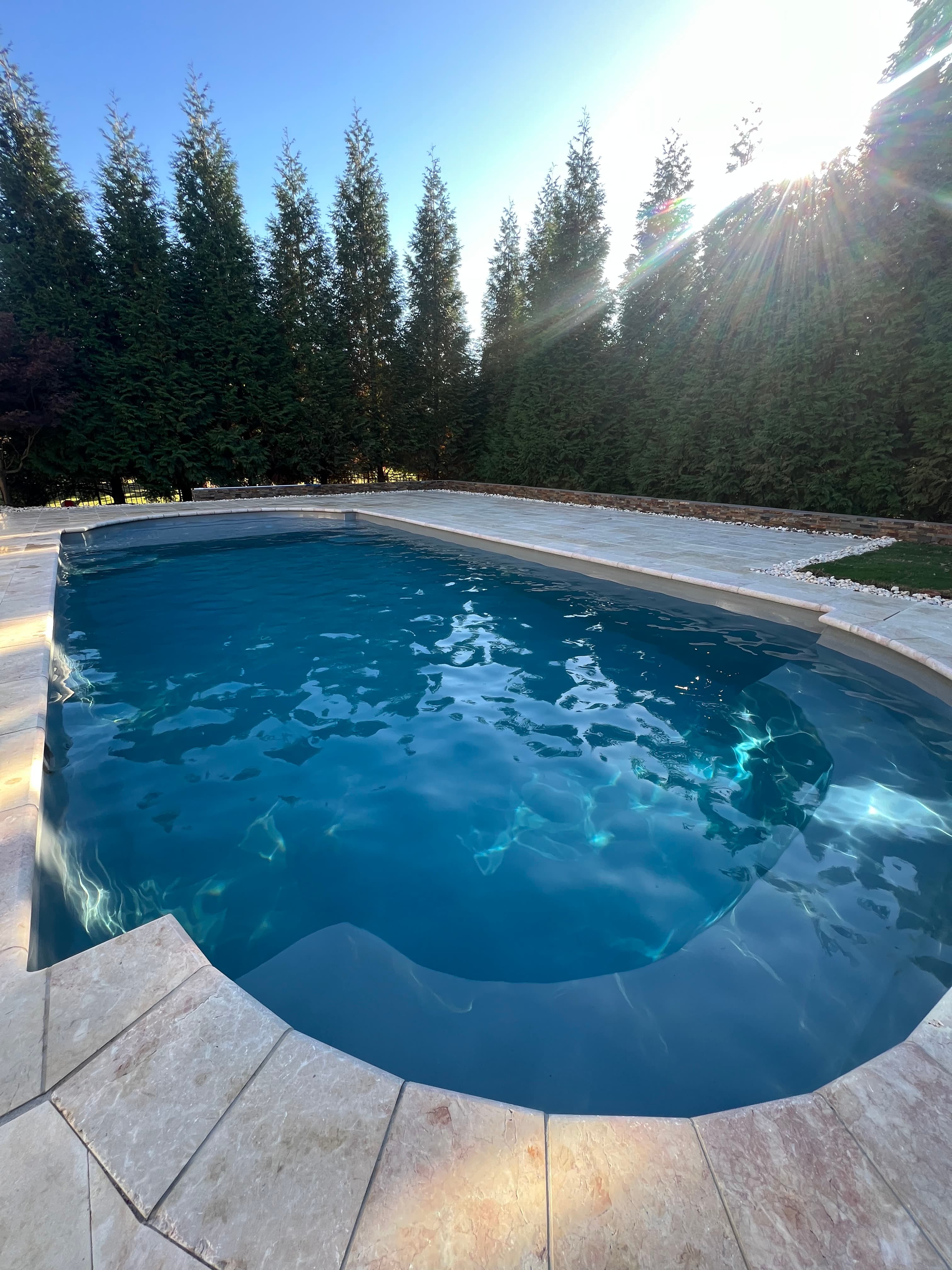 Blue residential pool with visibly hazy water